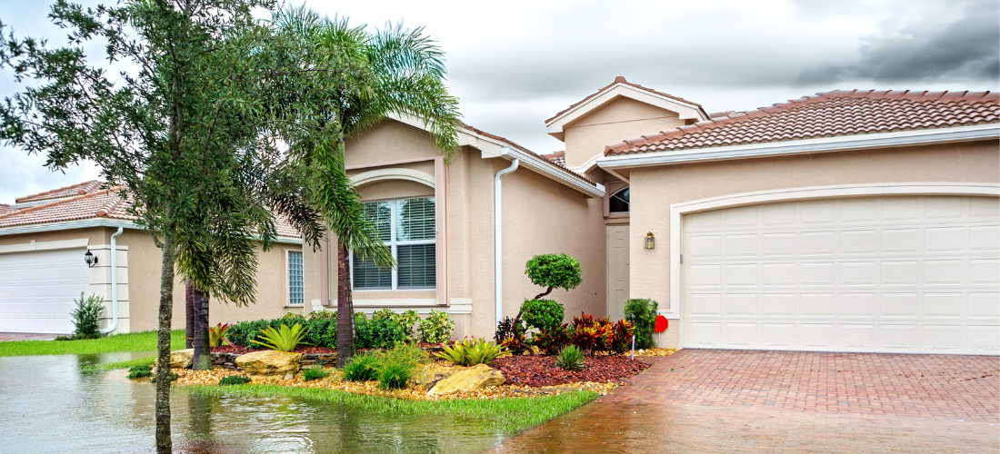 Florida home and garage door during a storm and flooding