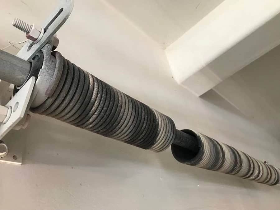 Broken garage door spring on residential unit