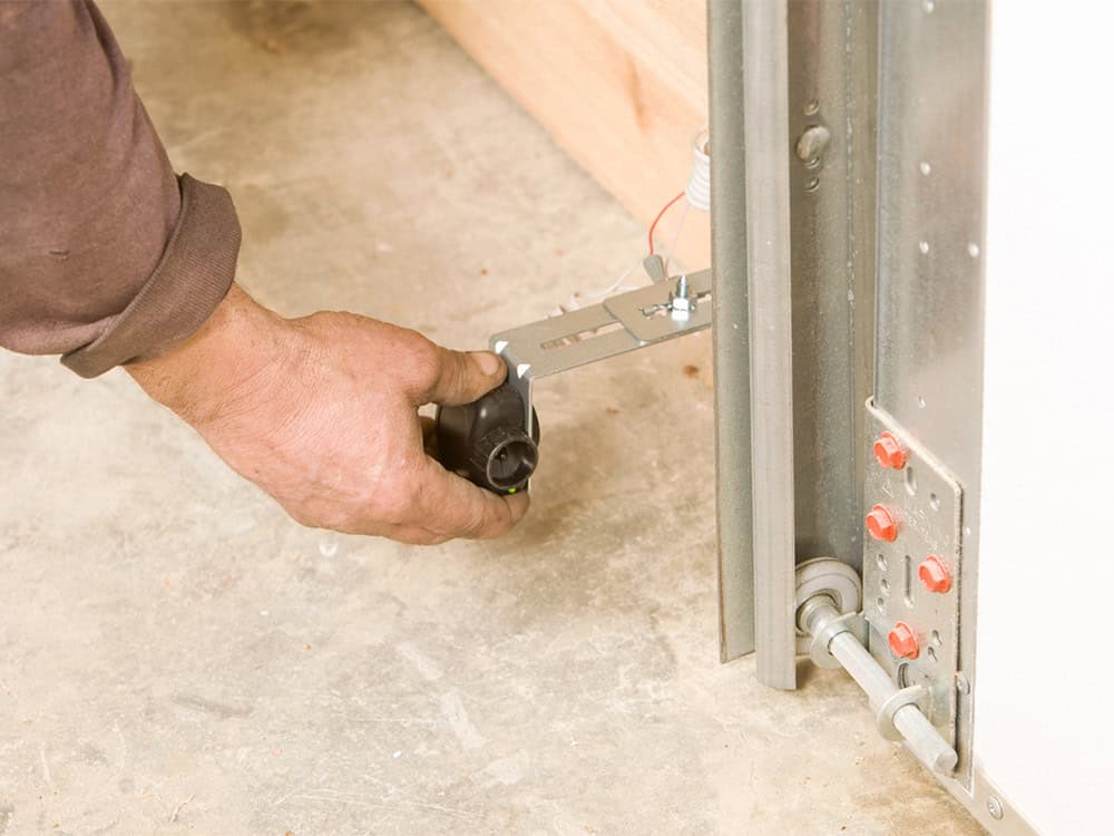 Garage door sensor repair and alignment